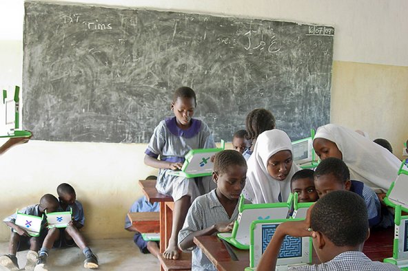 students using laptops from One Laptop Per Child