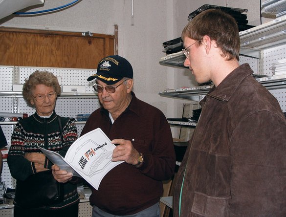 Kyle showing his grandfather iFixit, the free repair manual