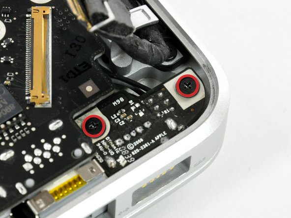 Image 1/1: Note: This step is not completely necessary, but it will make it easier to disconnect the cable that is connected to the DC-in board.