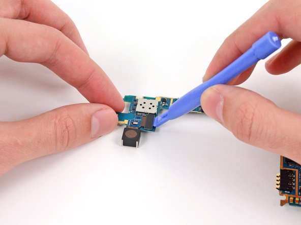 Image 1/2: Flip the motherboard over. We recommend setting it on a grounded work surface.