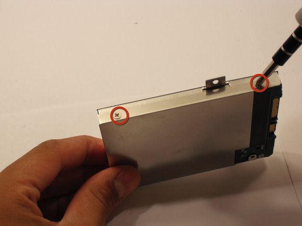 Remove the four 3.9 mm Phillips #1 screws from the hard drive casing.