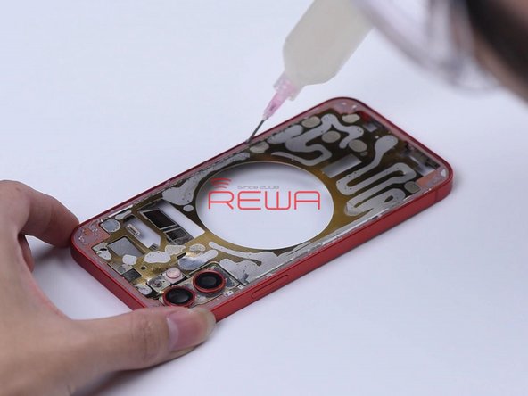 Apply some adhesive evenly on the middle frame. Put the back glass in position and press it gently against the middle frame.