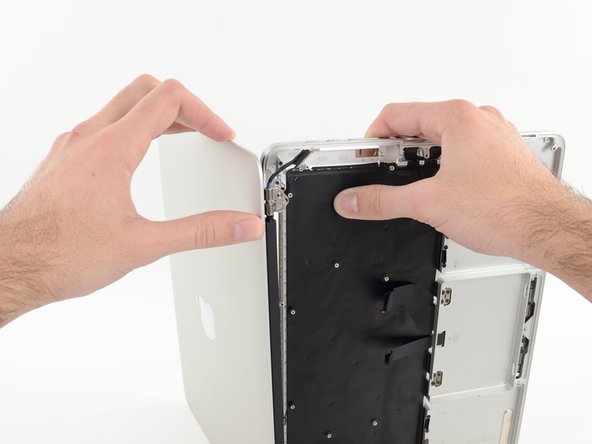 Image 2/3: Carefully set each component aside, making sure to set down the lower half keyboard-side down.