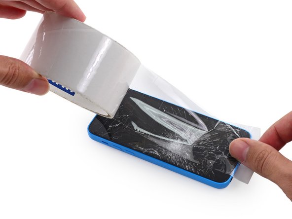 Image 2/3: This will keep glass shards contained and provide structural integrity when prying and lifting the display.