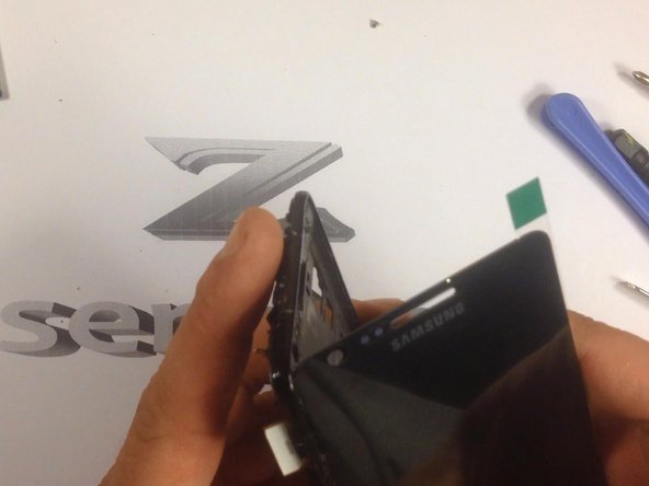 Many times the spare parts come without adhesive tape. In this situation you'll need to install double sided adhesive tape yourself. Also you can easy find adhesive sticker exactly for the model.