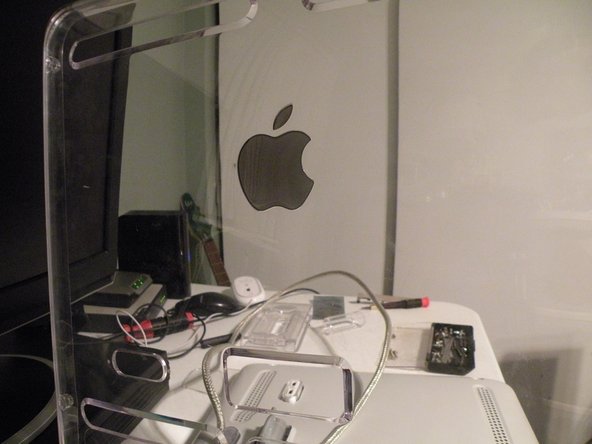 Image 3/3: Then lift the panel from the top of the display.