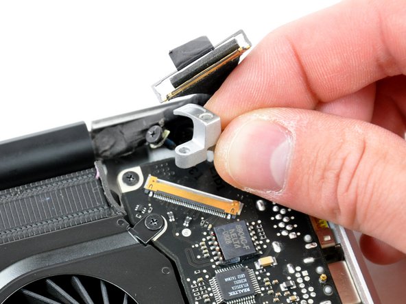Image 2/2: Lift the LVDS cable bracket out of the upper case.