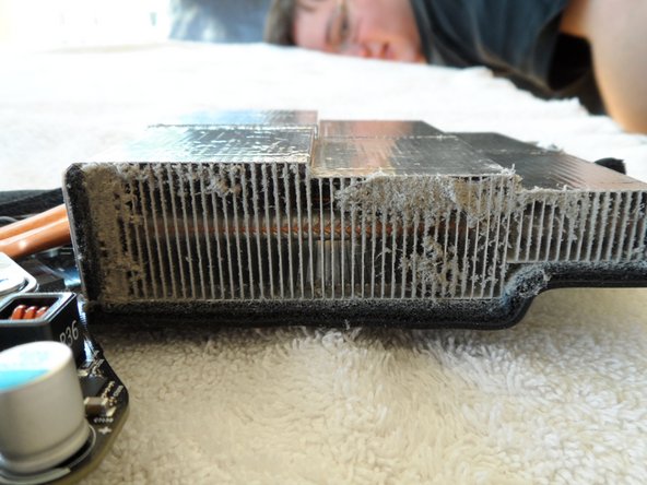 Image 3/3: Those heat pipes flow to fins above the main blower. This is what 4 years of dust accumulation looks like. Is this the reason my VRAM died?