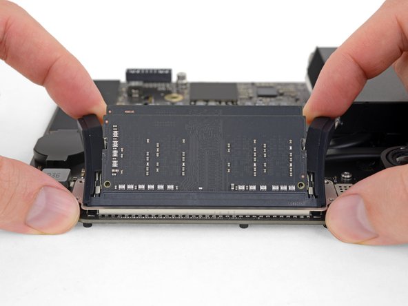 When released, the RAM modules will pop up at a slight angle.