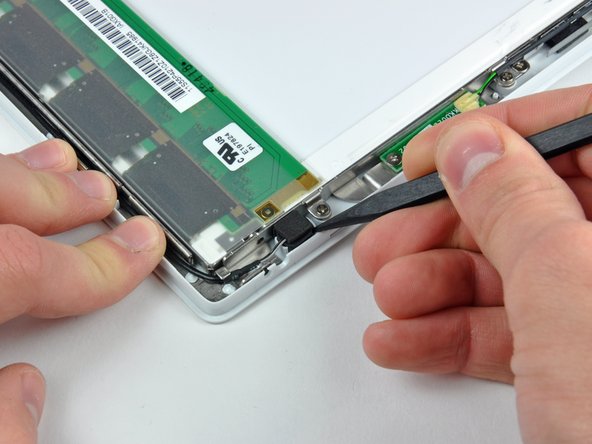 Image 1/2: De-route the microphone cable from around the top and side of the display.