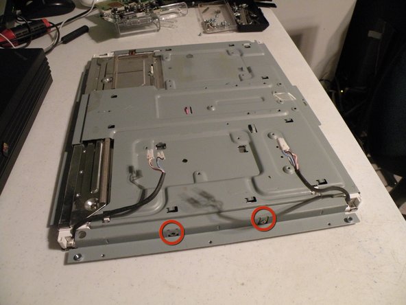 Image 3/3: Remove all of these screws from the metal frame.