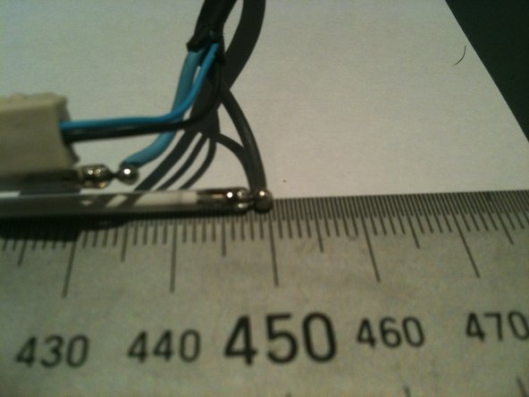 Image 3/3: There is a little figure 8 rubber band tying the 2 CCFL together at their centre.