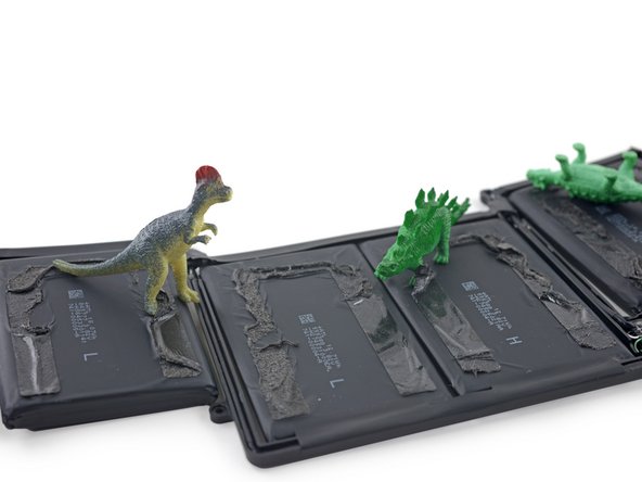 Image 3/3: Peeling back the battery reveals... gunk. Either Apple doesn't think you need to replace this battery, or someone accidentally dipped it in [https://www.youtube.com/watch?v=JO1dtHJF5bc&t=33|tar|new_window=true].