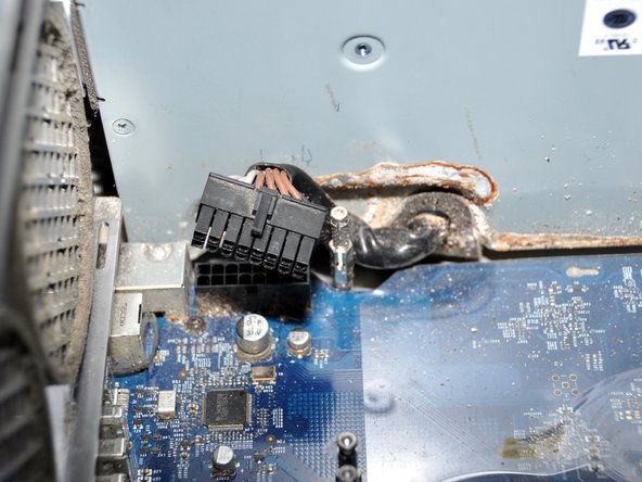 Image 3/3: Unplug the cord that is located below where the cooling unit was. To do this, pull outwards.