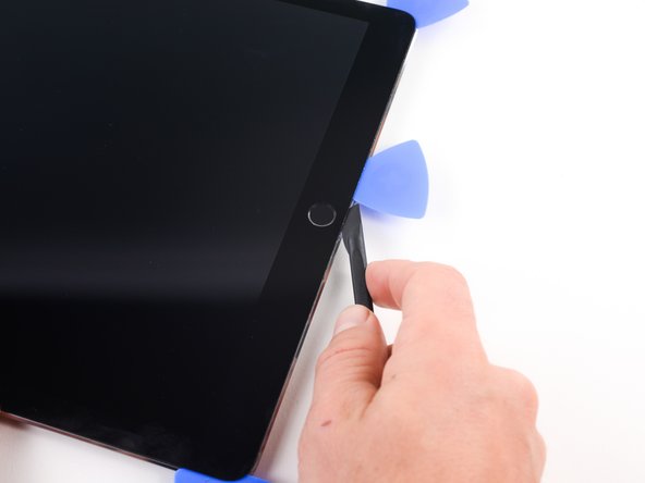 Pivot the halberd spudger so that you are slicing with the shortest portion of the blade.