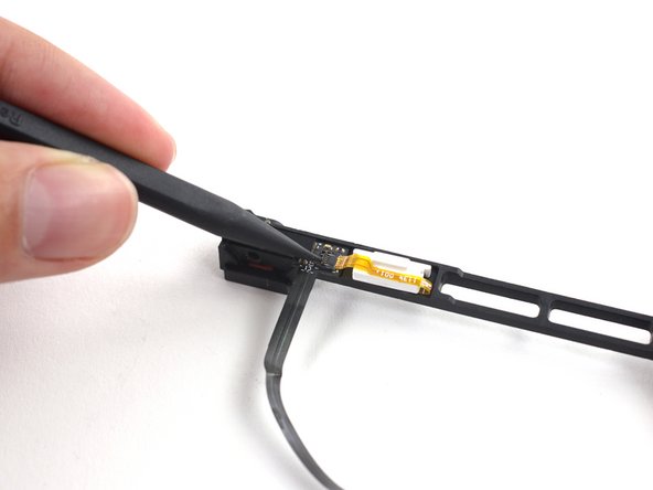 Image 1/3: Use the tip of a spudger to flip the ZIF connector on the hard drive cable.