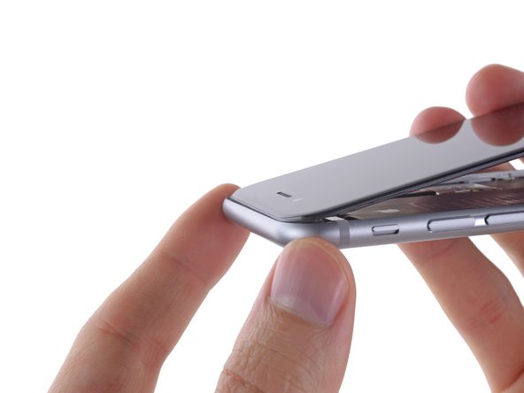 Image 3/3: During reassembly, align the clips just below the top edge of the rear case. Then, slide the front panel upward until its top edge is flush with that of the rear case.