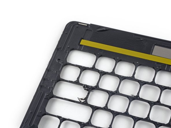 Image 2/2: Closer inspection shows these channels lead to tiny vents at the top of the keyboard.