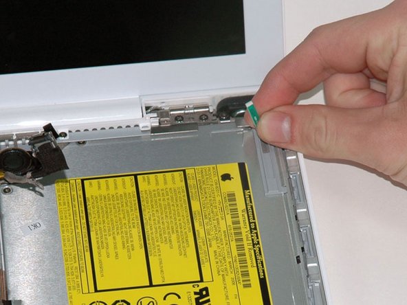 Lift the Bluetooth antenna board from the right side of the optical drive.