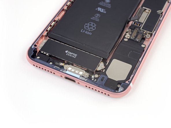 At this point you may still have very thin strips of release liner covering all of the adhesive, which prevents it from accidentally sticking to anything while you begin reassembling your iPhone. Don't remove these small release liners just yet.