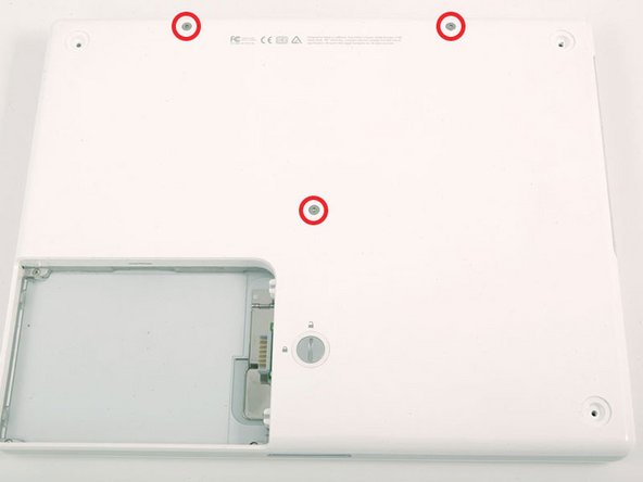 Image 1/1: The shorter screw is in the center of the computer.