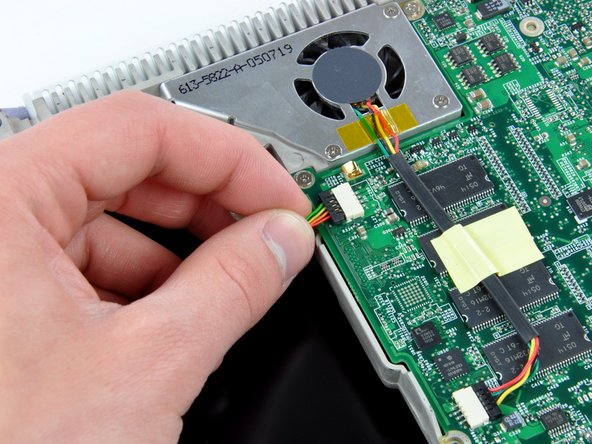 Image 1/1: Disconnect the inverter cable from the logic board and deroute it from the metal framework, removing tape as necessary.