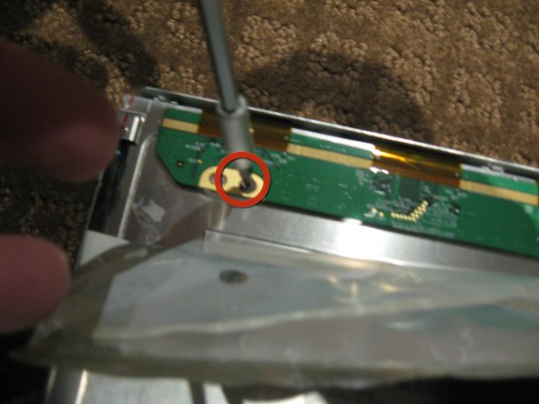Image 1/2: Remove the 2ea Philips head screws from each end of the PCB