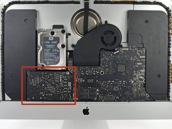 Image 3/3: Be very careful not to touch the capacitor leads or any exposed solder joints on the back of the power supply (boxed in red).