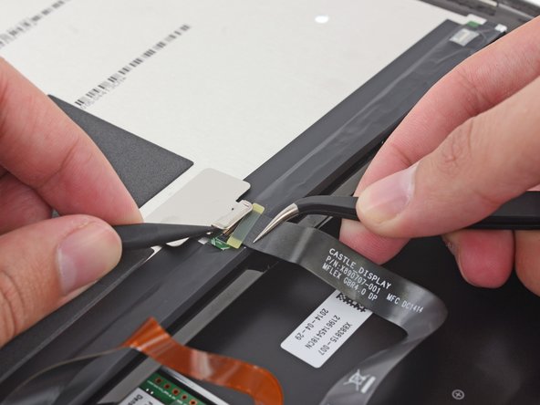 Image 1/3: At the other end of the cable, another dubious connector with a sliver of a contact board in tow. Because, why not?