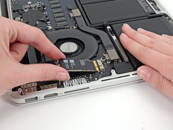 Image 2/3: It may reside in the same right-side location as [guide|11225|ye olde model|stepid=40195], but this here Broadcom [http://www.broadcom.com/products/Wireless-LAN/802.11-Wireless-LAN-Solutions/BCM4360|BCM94360CS|new_window=true] is a different animal.