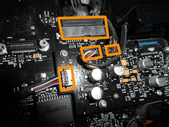 Image 3/3: You have four plugs to disconnect at this location: SATA bus, microphone, and the left and right speaker cables.