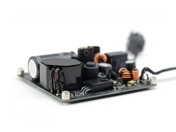 Image 1/2: From the looks of it, it is a fairly standard 12 V, 5 A power supply with your standard large capacitors and coils.