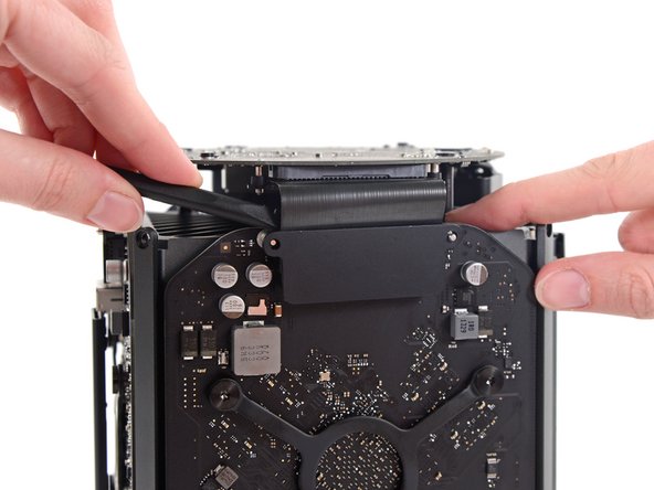 Image 2/3: Flip the connector up and out of the way of the graphics card.