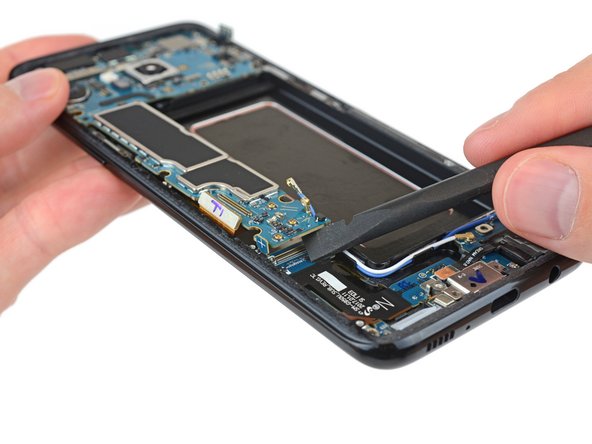 The I/O board connector is under the motherboard in these late-model Galaxy phones. Because why not make things harder?