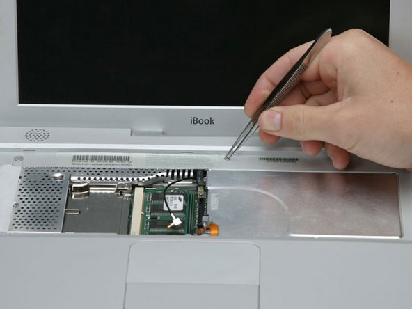 Image 1/1: Pry up the magnet covering a Phillips screw near the middle of the computer.
