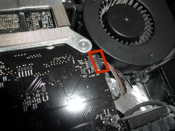 Image 2/3: You have four plugs to disconnect at this location: SATA bus, microphone, and the left and right speaker cables.