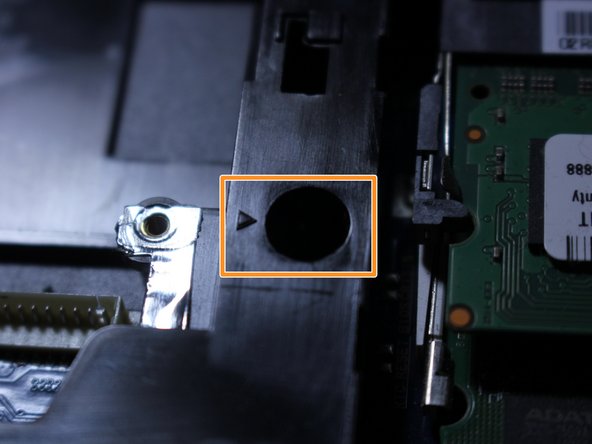 Each screw location is designated by the arrow icon highlighted in orange in the second photo.