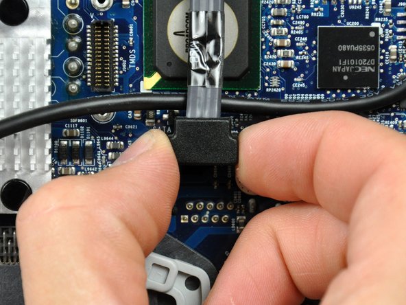 Image 1/1: The SATA connector on most iMacs tends to stick in its socket on the logic board. If you are having trouble disconnecting the SATA cable, insert a [product|IF145-012|metal spudger] or any other thin tool into the gap between the SATA connector and its socket and twist the spudger's shaft to safely separate the two pieces.