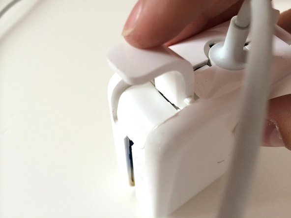 Image 3/3: Make sure the metal part goes UNDER the case, like so.