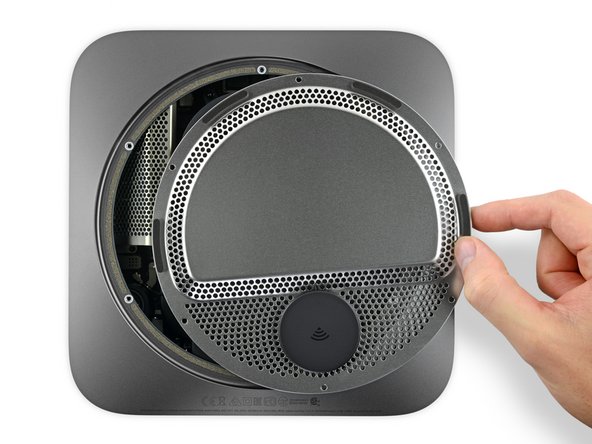 With the Mac mini's ports facing you, carefully lift the antenna plate and slide it about an inch to the right.