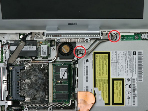 Image 1/1: Remove the two Phillips screws securing the optical drive to the metal framework.