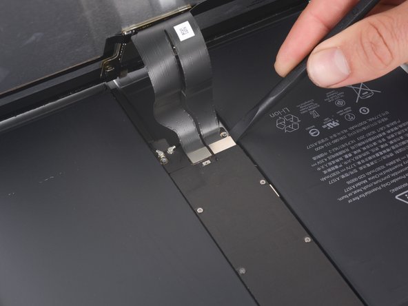 Use the flat end of a spudger to disconnect the two display data and digitizer cables from their respective sockets on the motherboard.