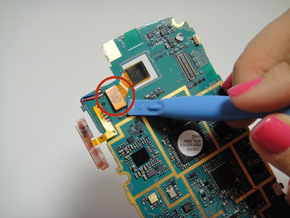 Image 1/2: Connect new camera into the motherboard and reverse the steps to put the phone back together.