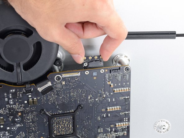 Image 3/3: When reinstalling the card, be sure it is properly seated before reinstalling its retaining screw.