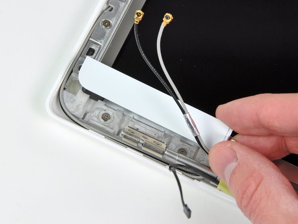 Do not lift up vertically on the cover! Unlike the large display bezel, this one has horizontal hooks to keep it in place. These will break easily.