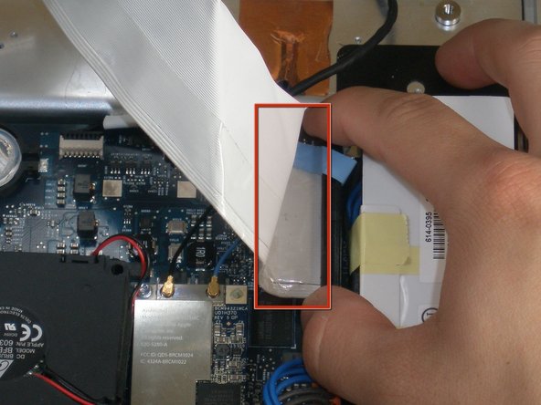 Image 2/2: During reassembly, make sure the hard drive data cable is firmly seated in its socket on the logic board; otherwise, during boot-up you will see a flashing question mark "?".