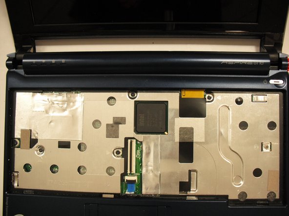 Turn the netbook back over and open the display with the keyboard cavity facing you.
