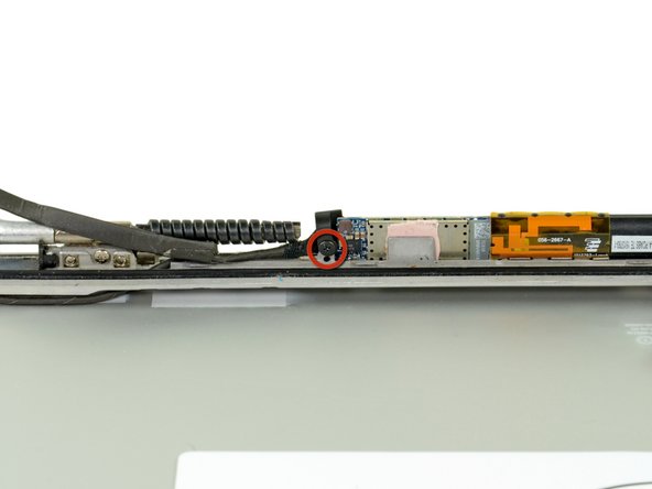 Image 1/2: Lift and remove the plastic tab up off the inverter board.