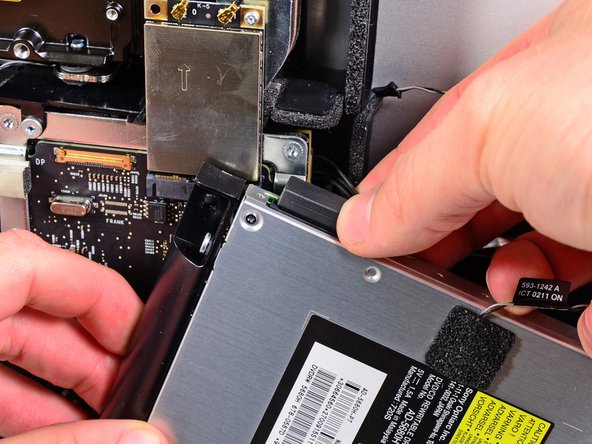 Image 1/1: Remove the optical drive from the iMac.
