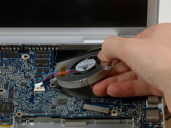 Image 1/1: Lift the right fan up while carefully peeling up the tape which secures the fan to the heat sink.